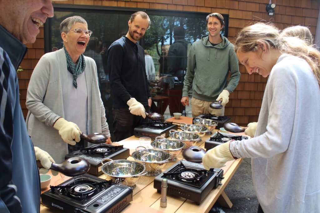 A group roasting coffee beans at Punto Fino Coffee Roasters, a caffeinated team building activity near San Francisco.