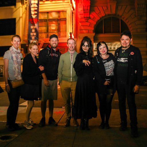 A team posing after a Chinatown ghost tour, a spooky and engaging team building activity.