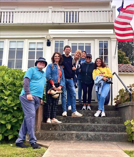 A team posing after a Presidio walking tour, a scenic and historical team building activity.