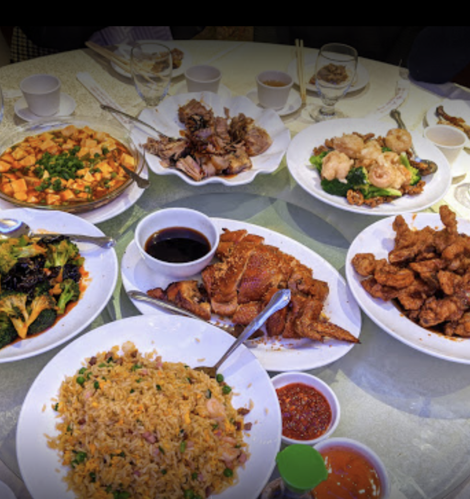 A table of plates of dim sum in NYC. 