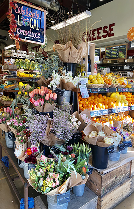 The charming storefront of Bi-Rite Market, an artisanal grocery near the Painted Ladies, perfect for picnic essentials and gourmet sandwiches.