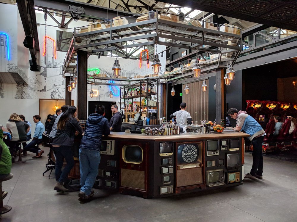 A couple playing arcade games at Emporium SF, one of the fun things to do on Valentine's Day.