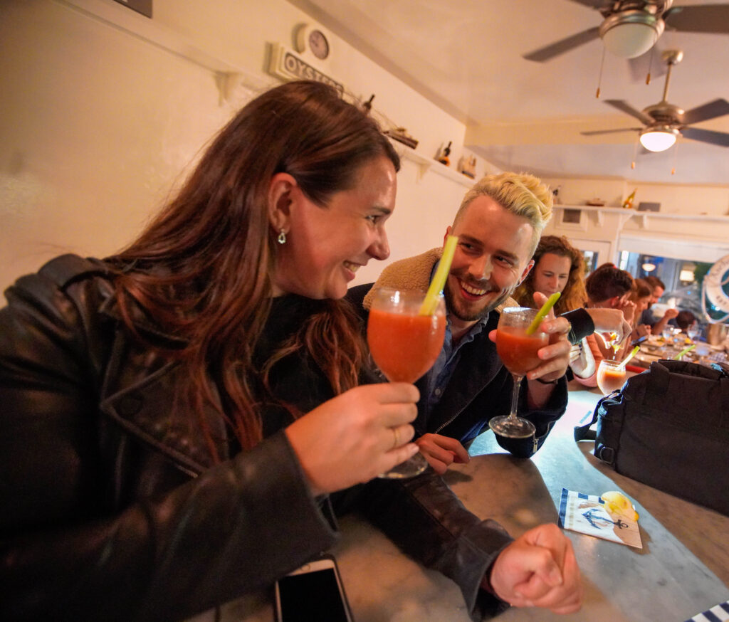 Toasting cocktails with clients on a food tour with Stretchy Pants Food Tours in San Francisco.