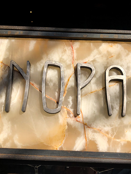 Nopa restaurant sign, located just steps from the Painted Ladies, a trendy San Francisco spot for seasonal dishes and brunch classics.