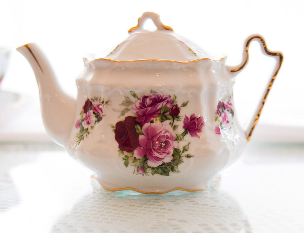 Delicate porcelin tea pot to go with brunch of  tea sandwiches, petit fours, and scones with clotted cream at Sip Tea Room. 